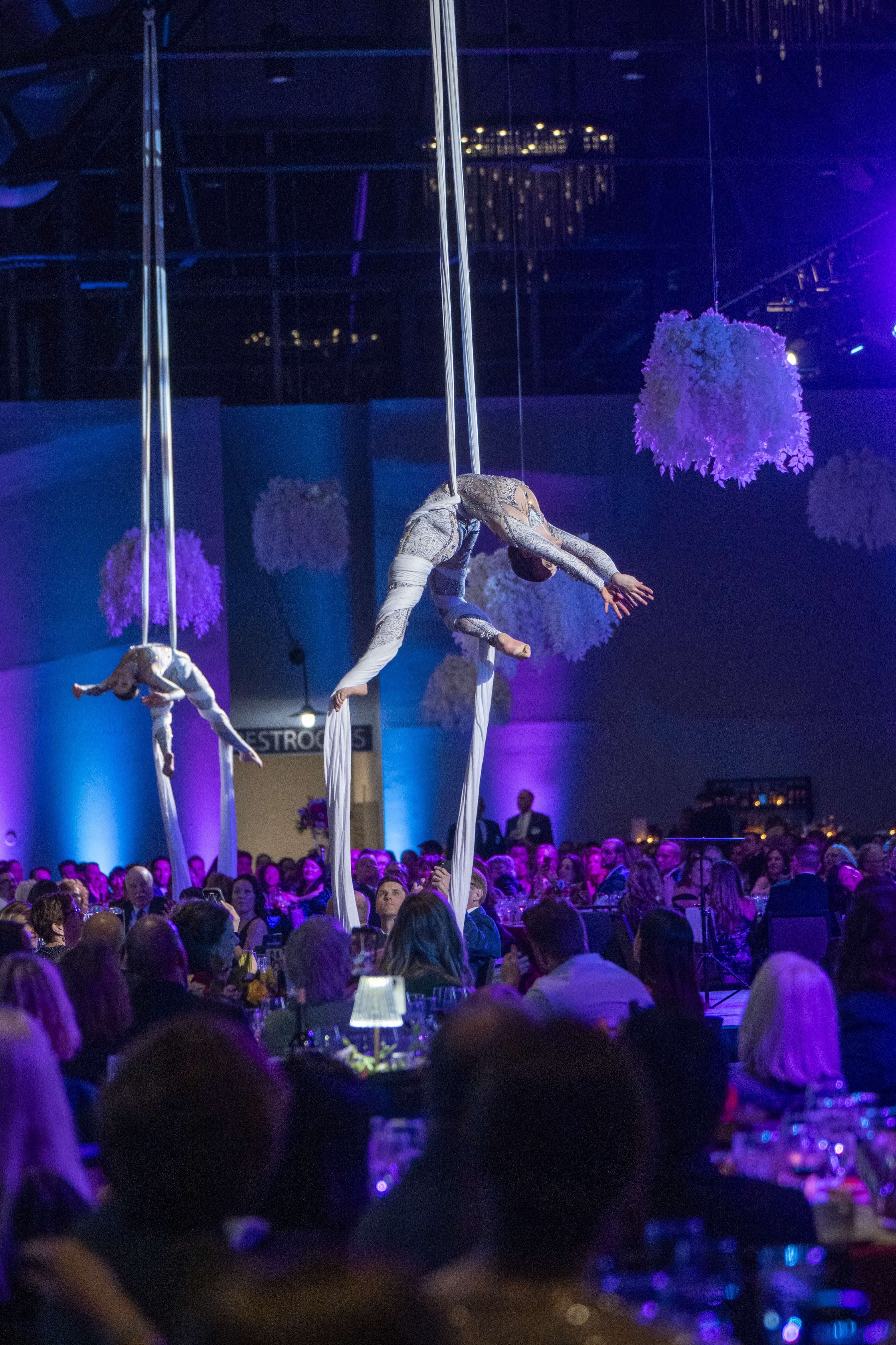 Angel Gala attendees cheers-ing to an incredible event.