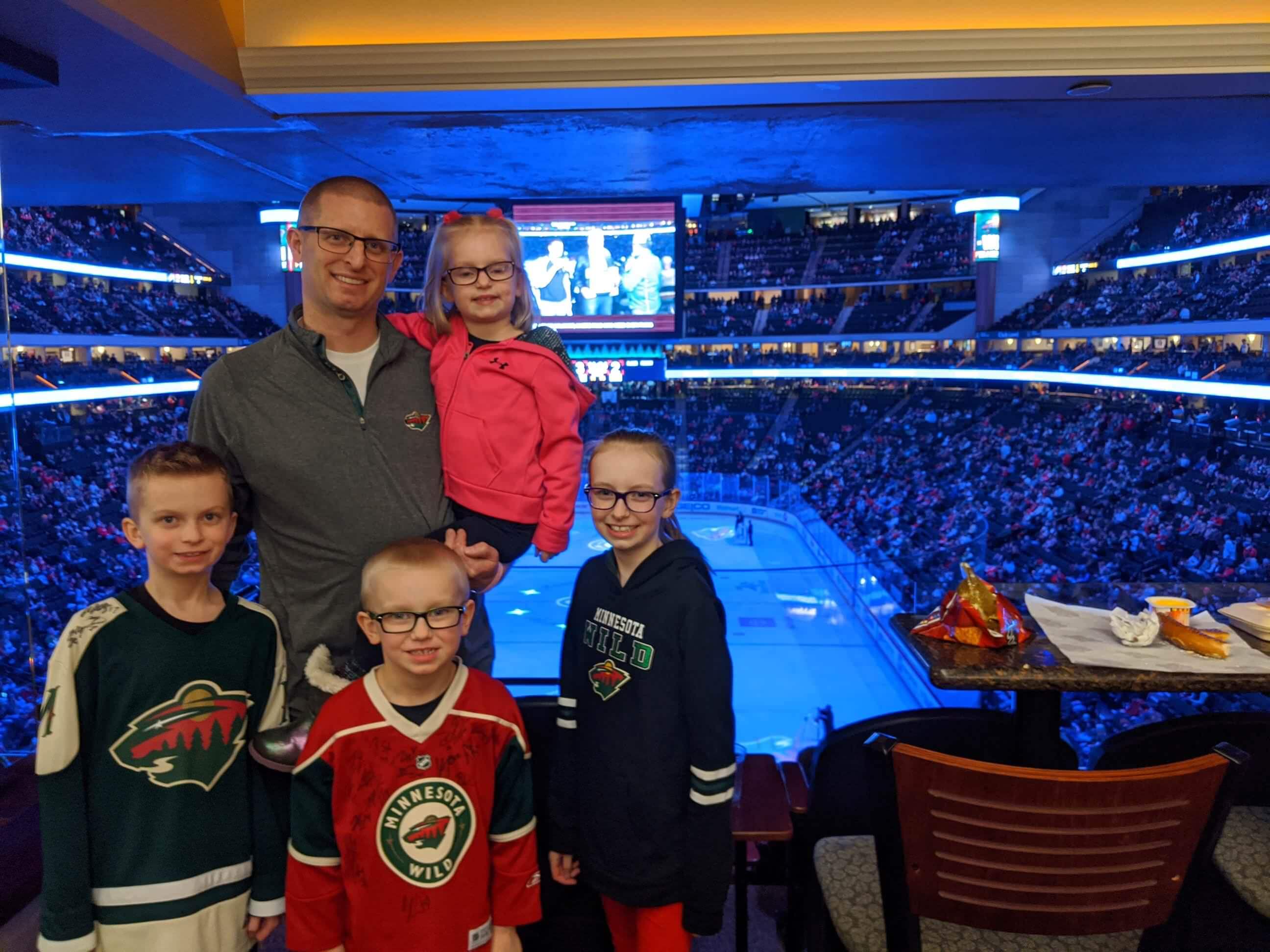 Family attends a Minnesota Wild hockey game through the Making Memories program.