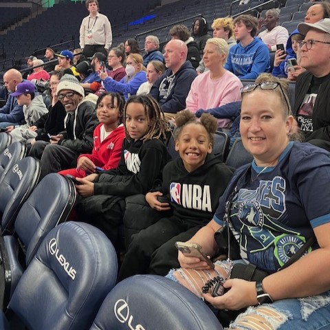 A family attending a sports game.