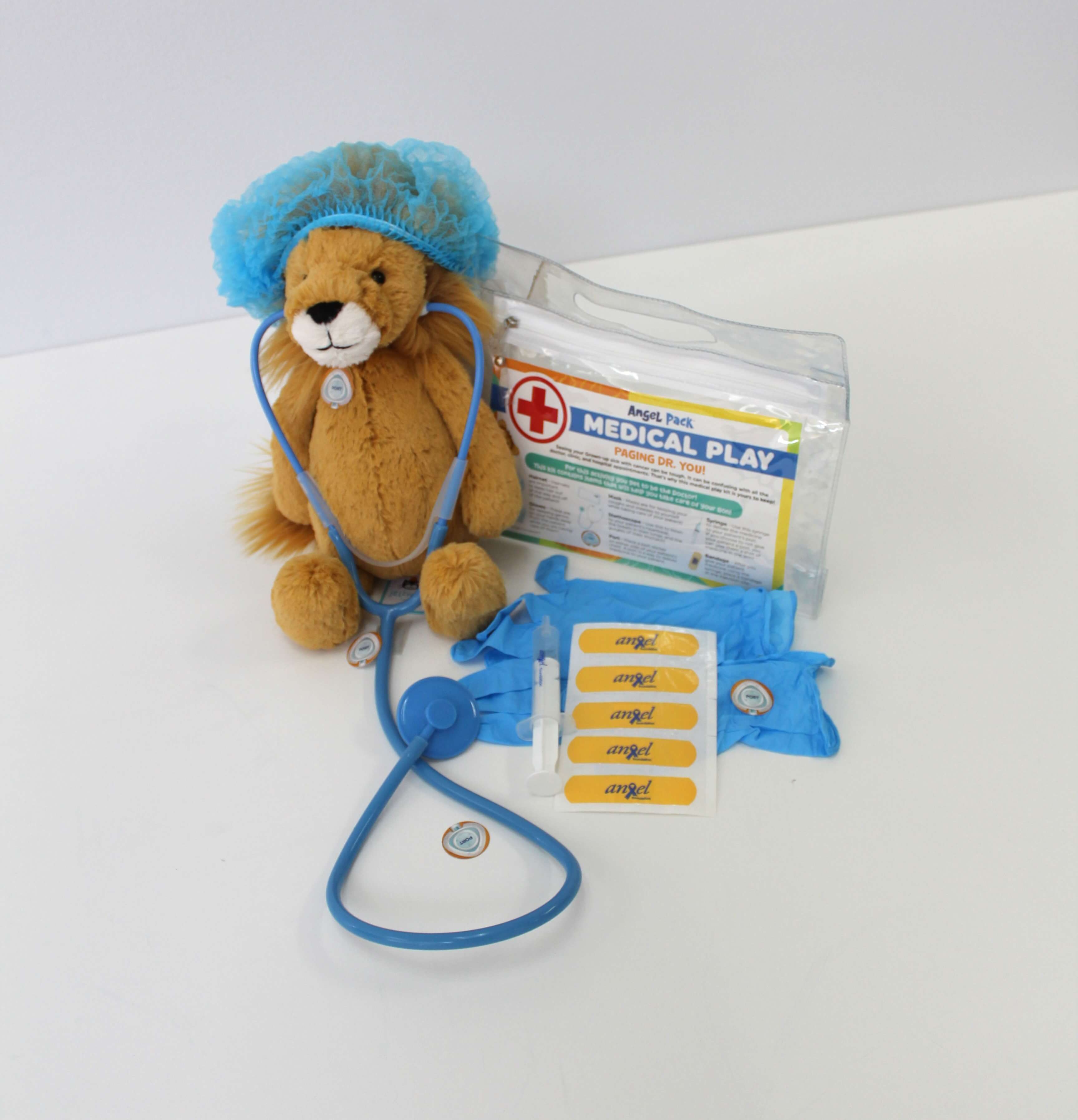 Rory the stuffed lion in medical play gear.