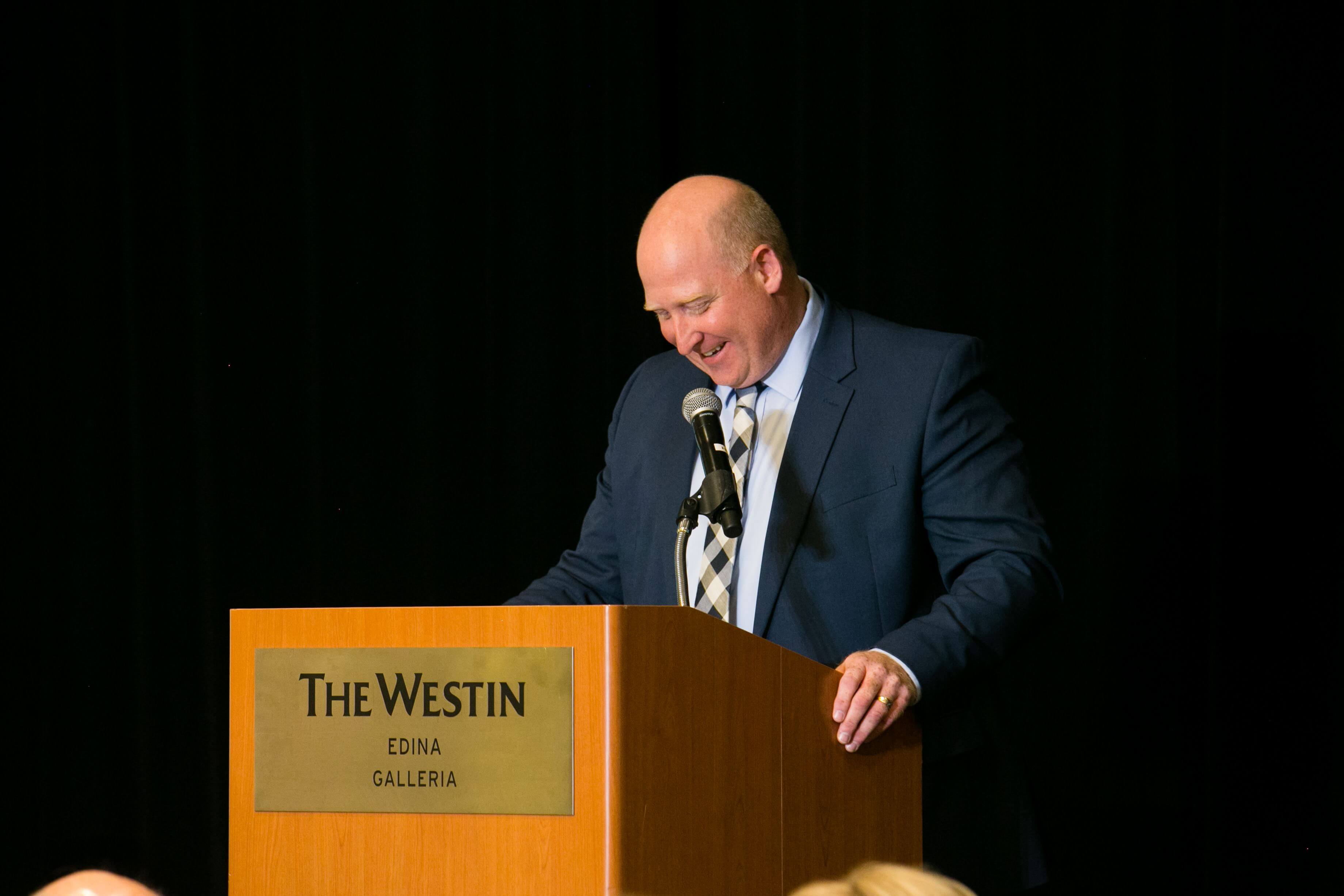 President & CEO Dave Becker speaking at the Lives We Touch Luncheon