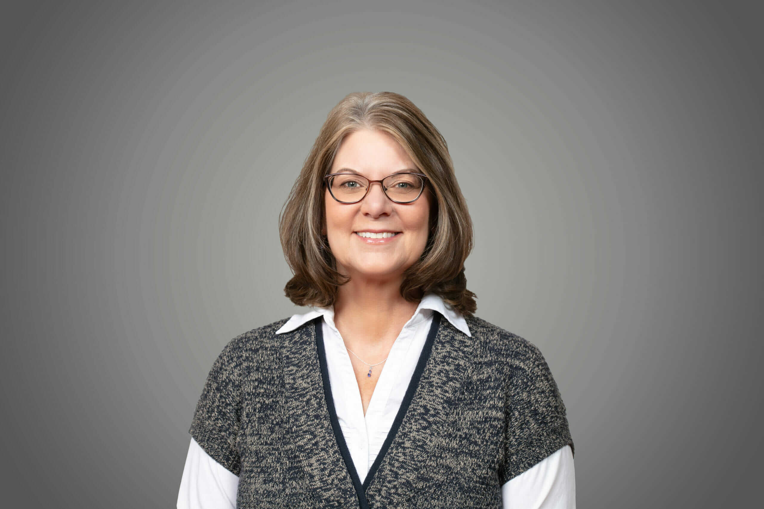 A headshot of Amy Rewey