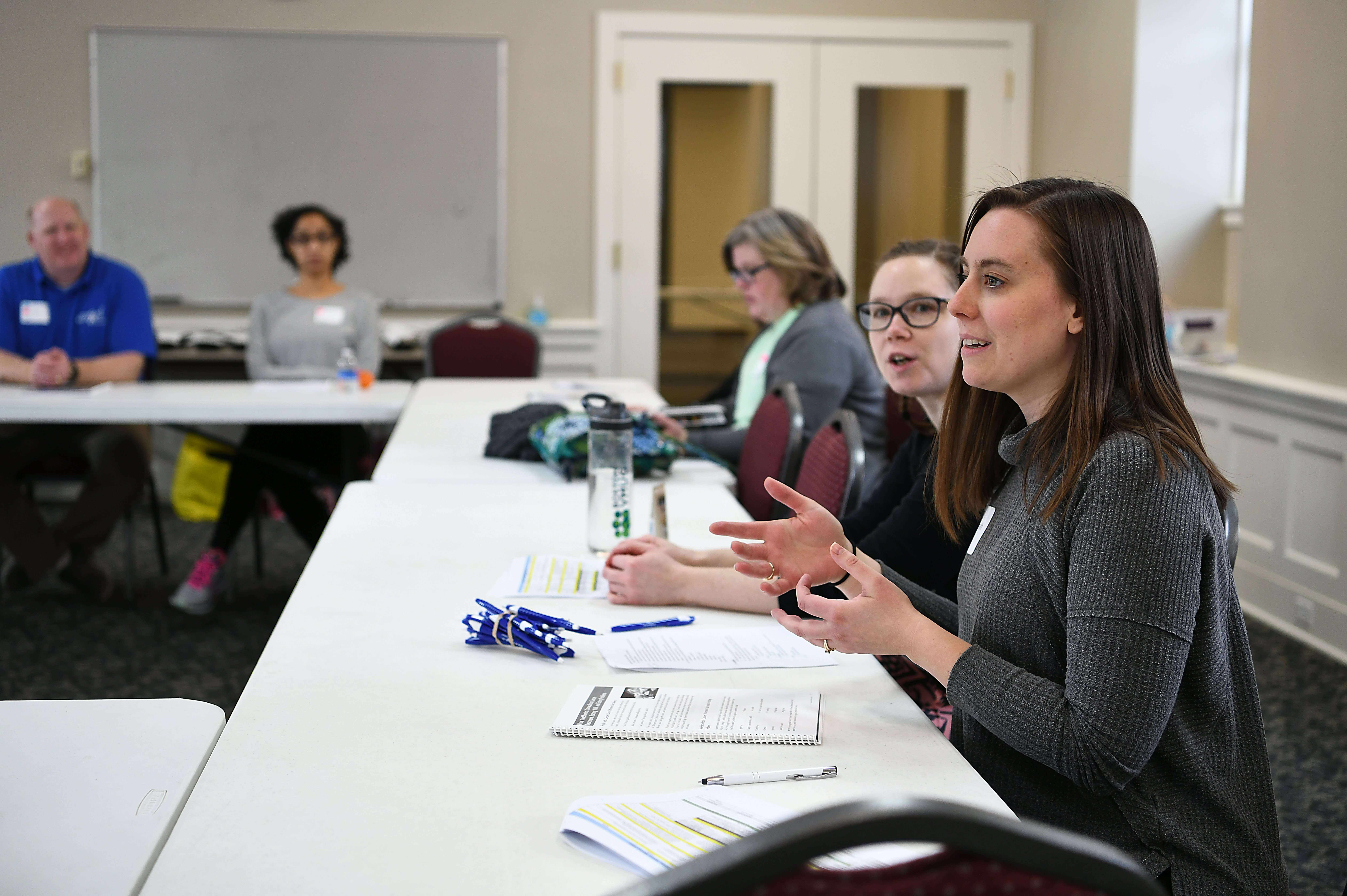 A woman speaking to a group.